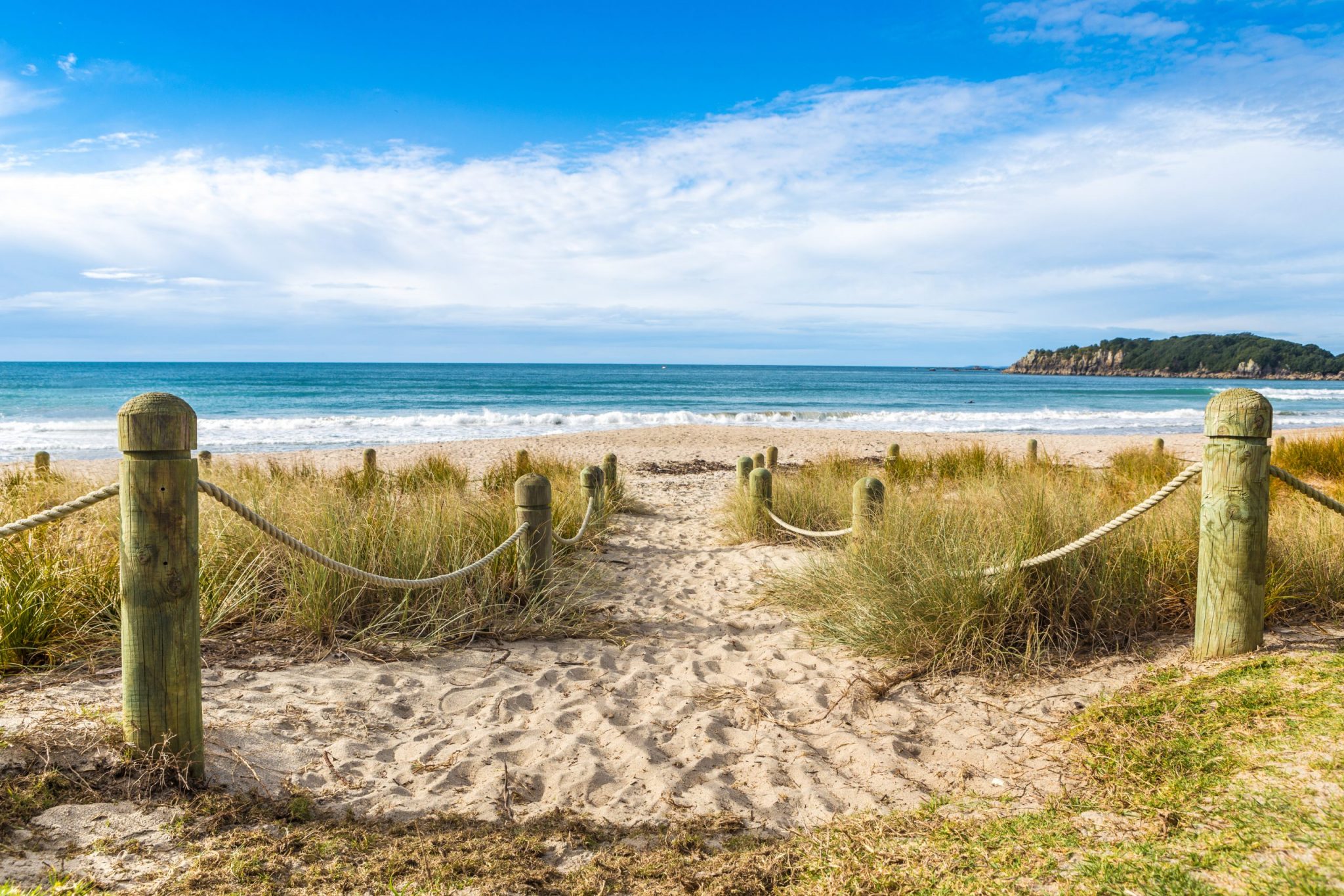 Entrance to the beach in sunny day